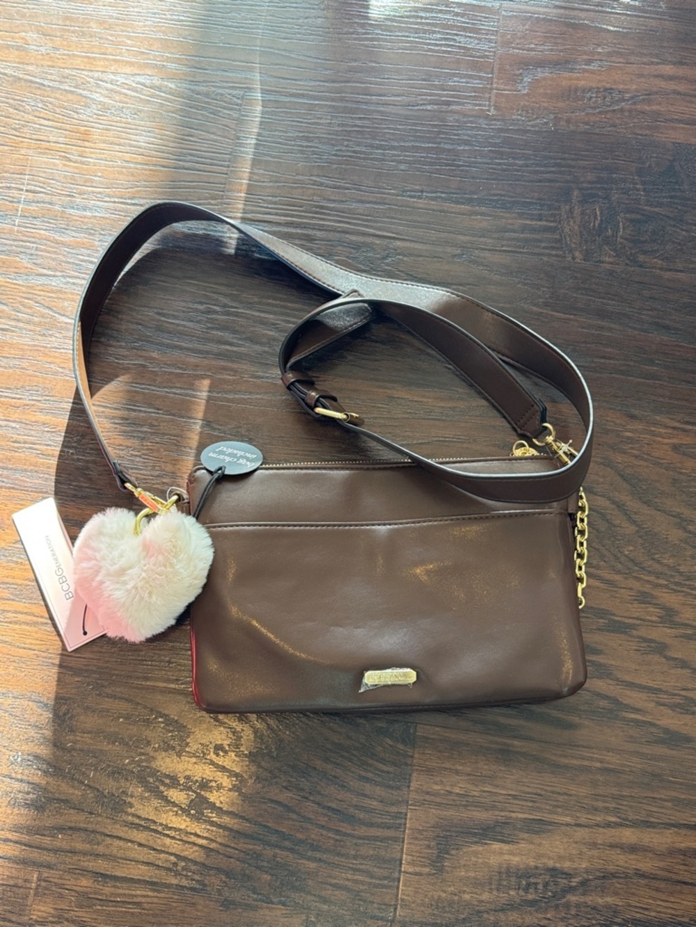 BCBGeneration Brown Leather Crossbody with Heart Pom Pom Charm